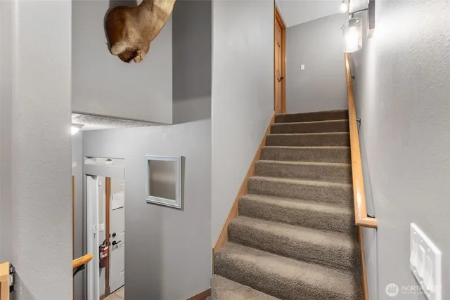 a view of a livingroom with furniture and a flat screen tv