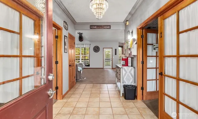 a kitchen with stainless steel appliances granite countertop a stove and a window