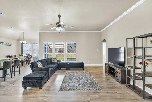 a kitchen with stainless steel appliances granite countertop a sink refrigerator and microwave