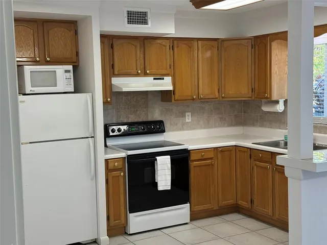 a view of a bathroom with a tub and sink