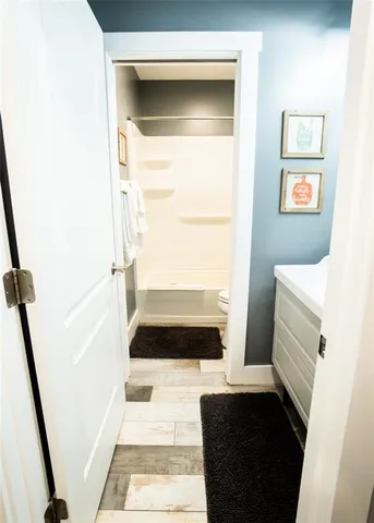 a backyard of a house with lots of green space and fountain