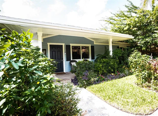 a bathroom with a glass shower door and mirror