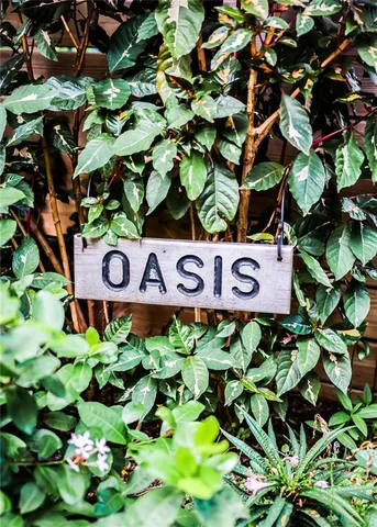 a bathroom with a sink a light fixture and a toilet