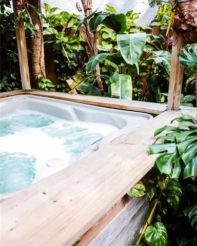 a bedroom with a bed and a black countertop white cabinet