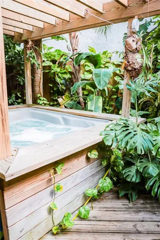 a living room with furniture and a dining table