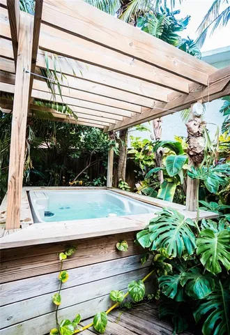a view of a patio with table and chairs and potted plants