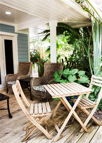 a view of a room with furniture and a rug