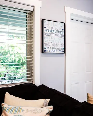 a bedroom with a bed window and dresser