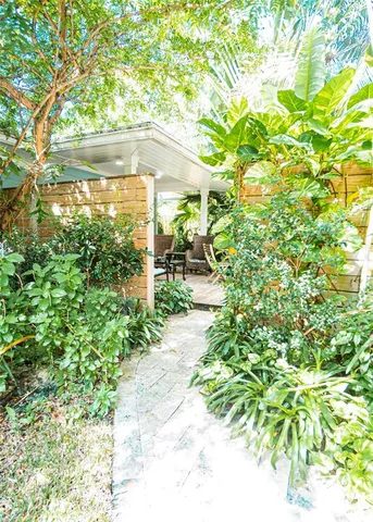 a bathroom with a double vanity sink toilet and a mirror