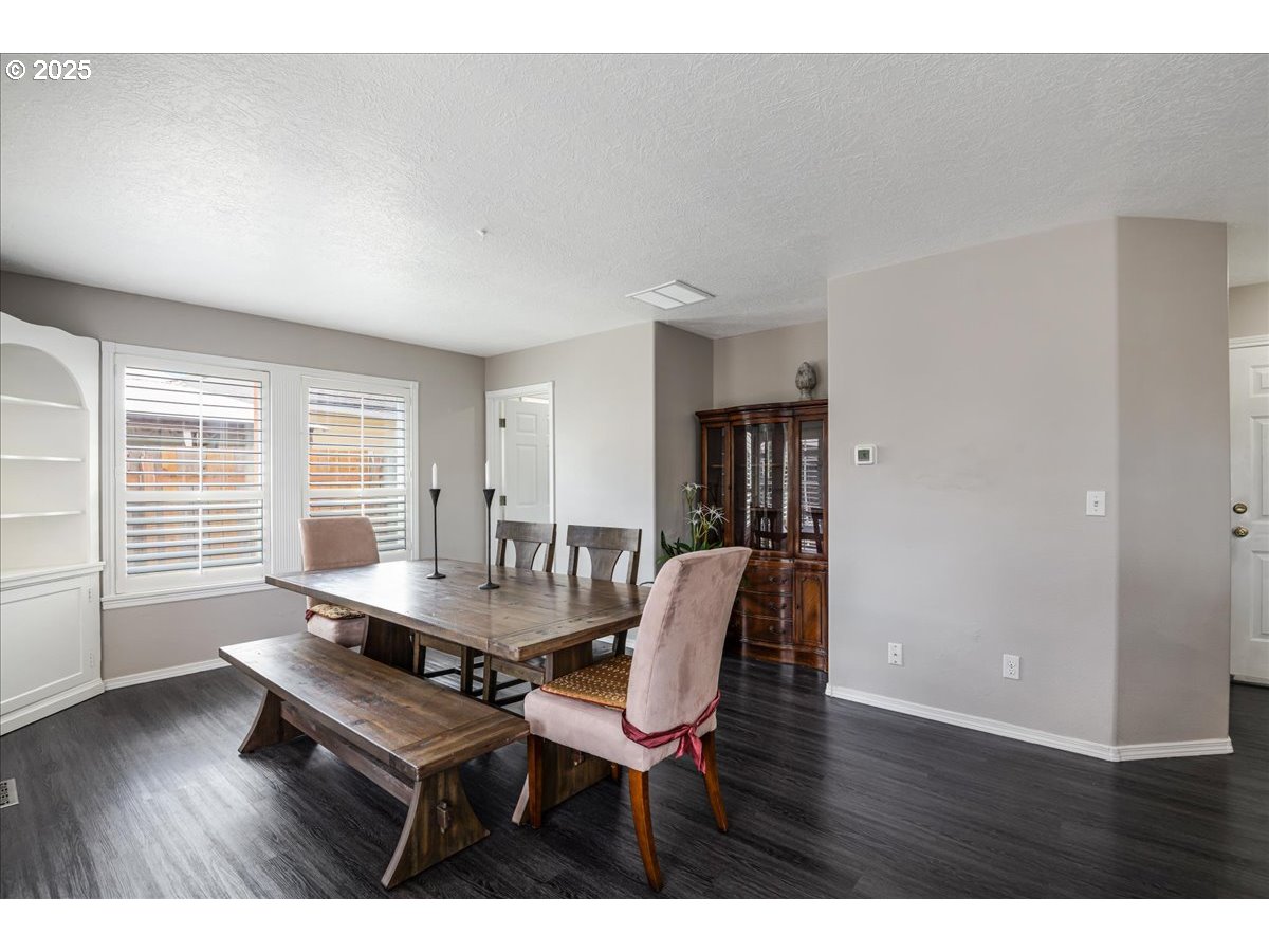 3253 Southeast 24th Terrace Gresham, OR 97080 - Photo 18 of 43 a dining room with furniture and wooden floor