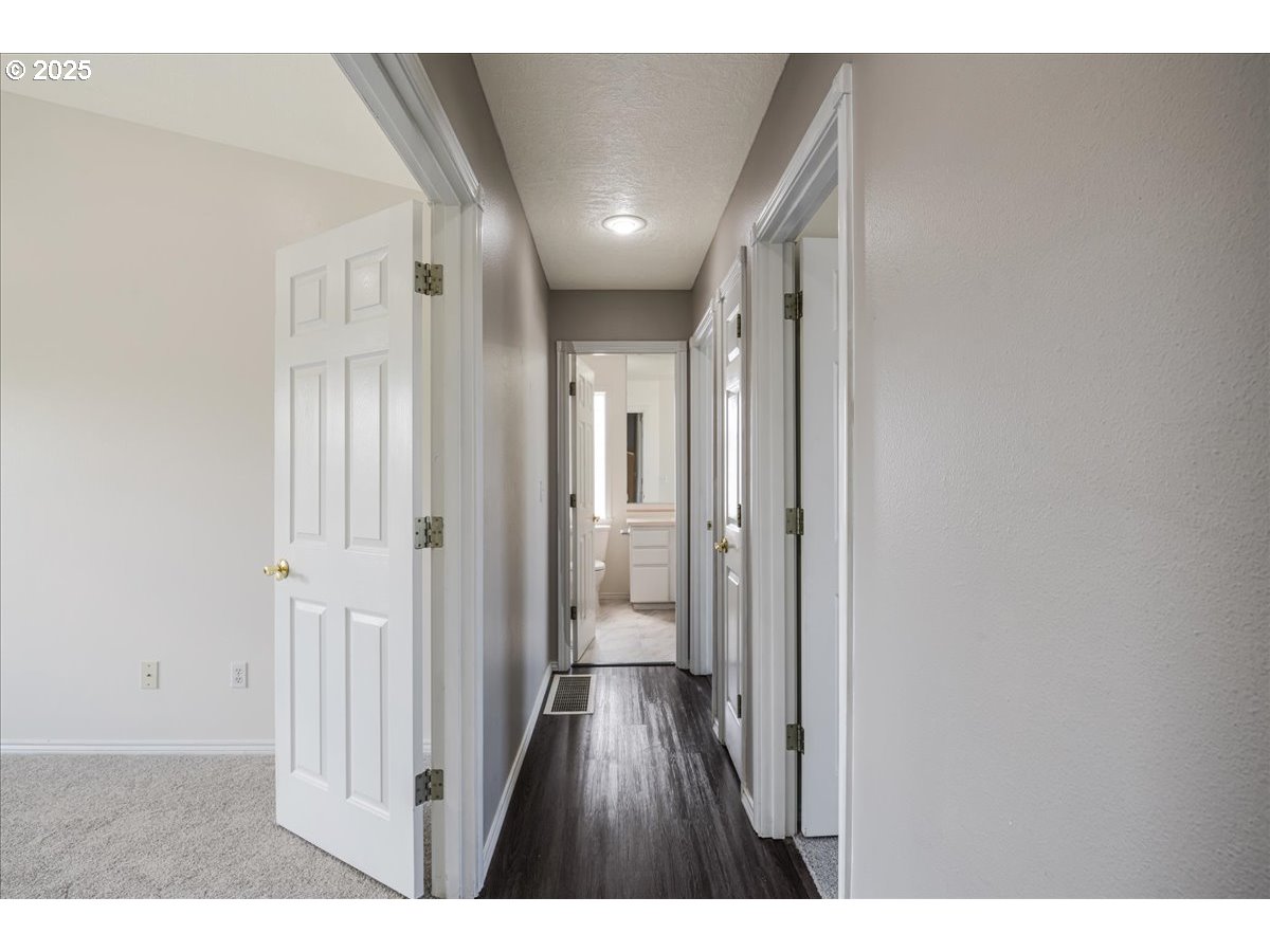 3253 Southeast 24th Terrace Gresham, OR 97080 - Photo 22 of 43 a view of a hallway with wooden floor