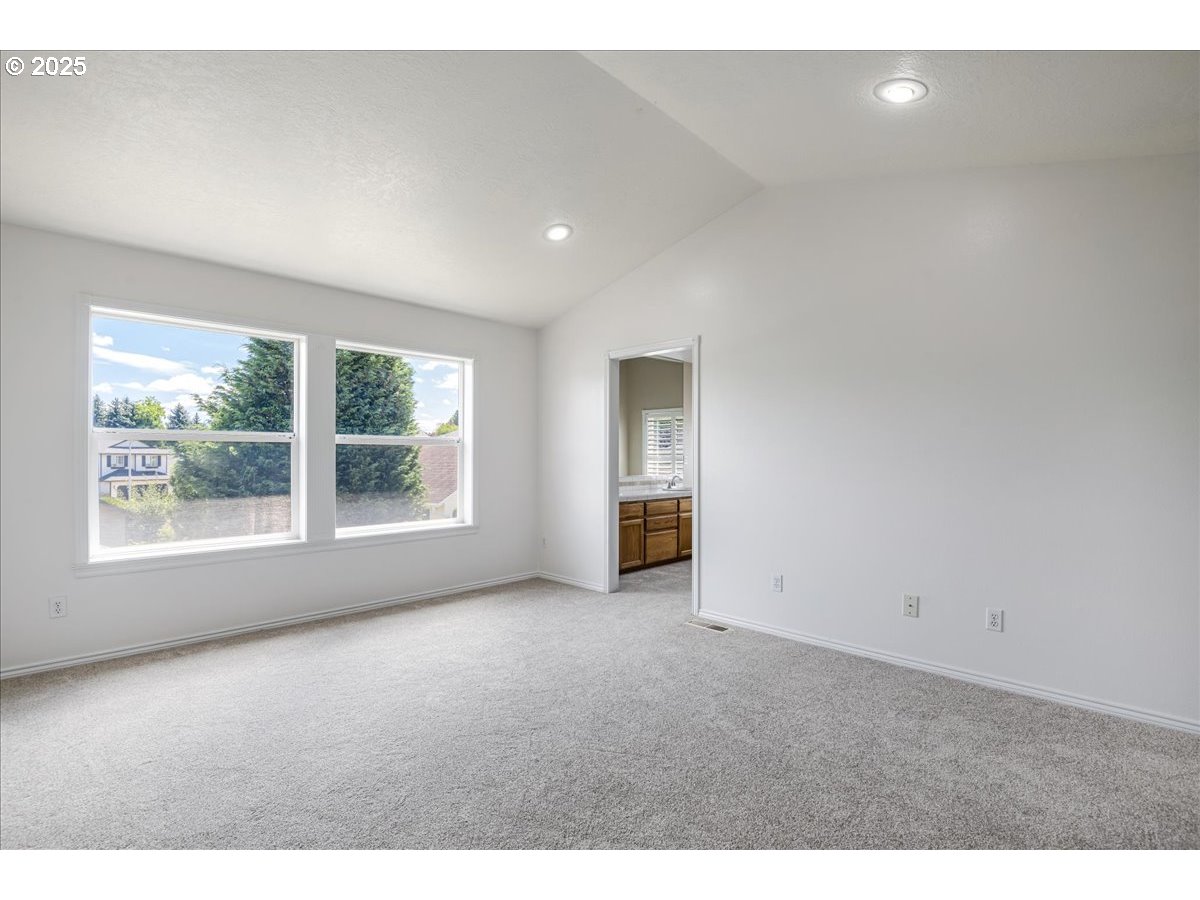 3253 Southeast 24th Terrace Gresham, OR 97080 - Photo 23 of 43 a view of an empty room with a window