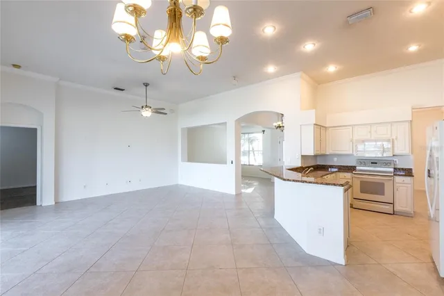 a large kitchen with cabinets and stainless steel appliances