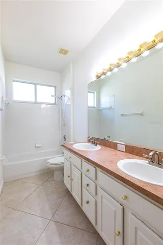 a bathroom with a tub and sink