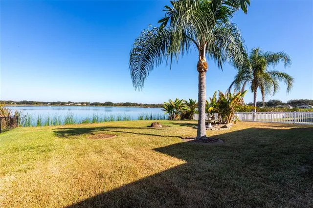 a view of a lake with a big yard
