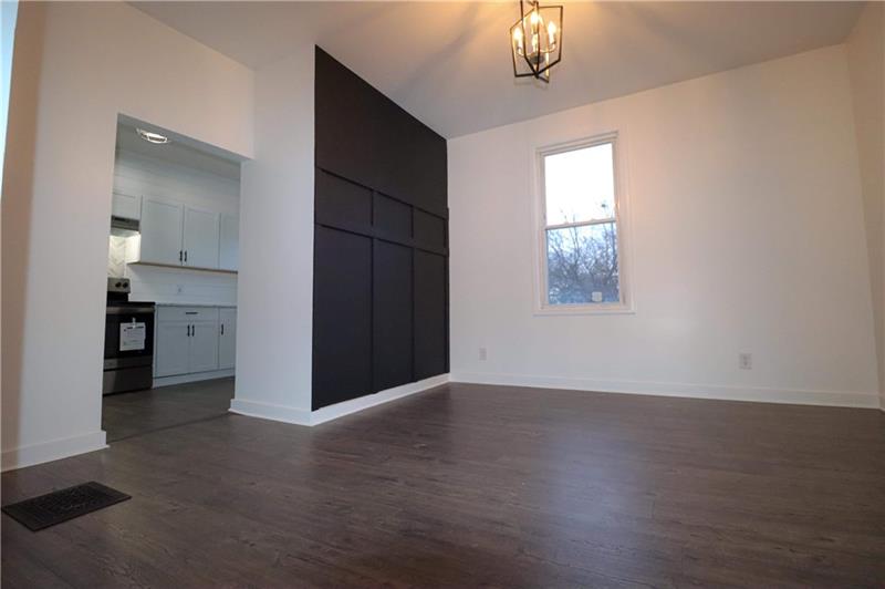 363 Reno Street Rochester, PA 15074 - Photo 15 of 37 wooden floor in an empty room with a window