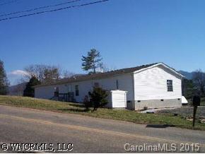 207 Keeter Road Waynesville, NC 28786 - Photo 6 of 8 a view of a house with a yard and garage