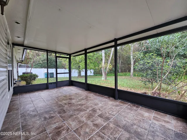 a view of a big room with a large window