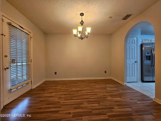a view of a livingroom with wooden floor