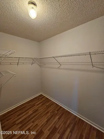 a view of a room with racks on the wall