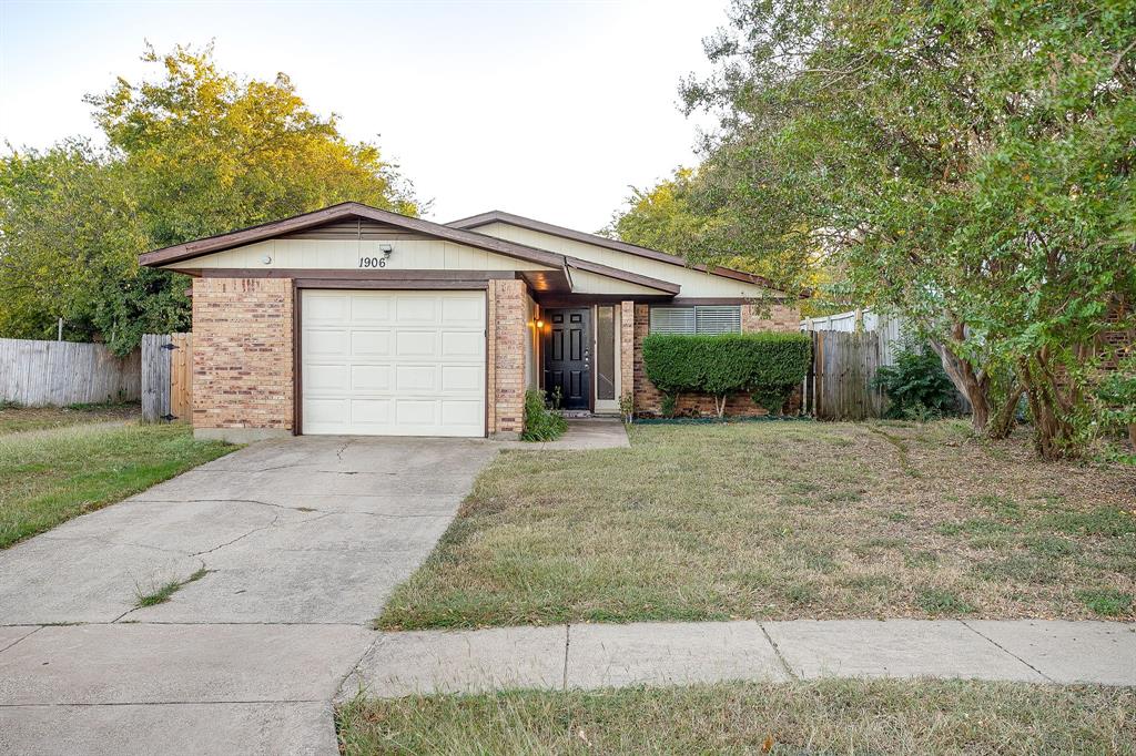 1906 Beacon Way Fort Worth, TX 76140 - Photo 1 of 36 a front view of a house with a yard and garage