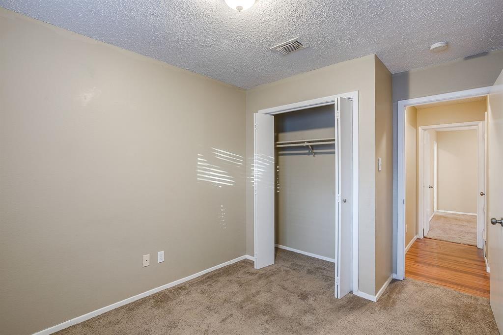 1906 Beacon Way Fort Worth, TX 76140 - Photo 18 of 36 a view of an empty room with closet and a bathroom