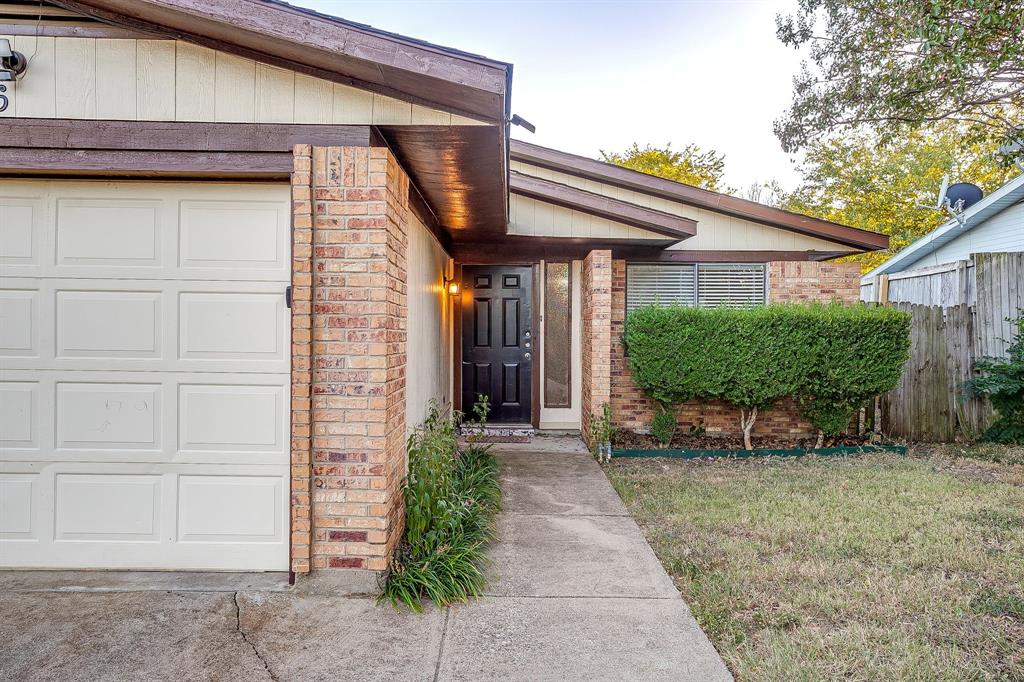 1906 Beacon Way Fort Worth, TX 76140 - Photo 2 of 36 a front view of a house with garden