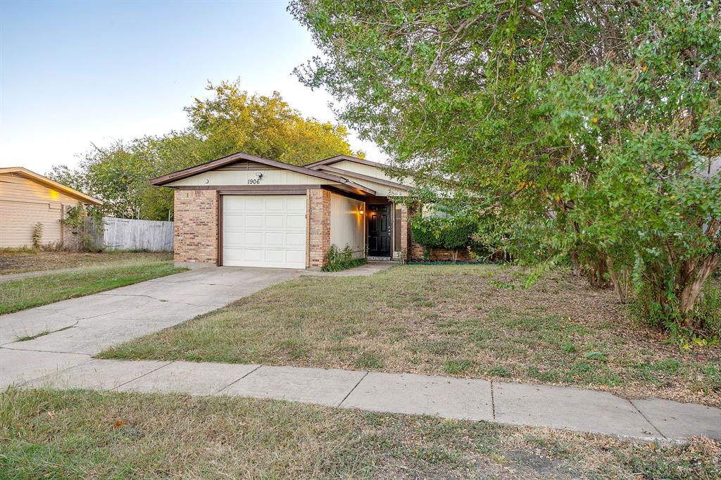 1906 Beacon Way Fort Worth, TX 76140 - Photo 36 of 36 a front view of a house with a yard and garage