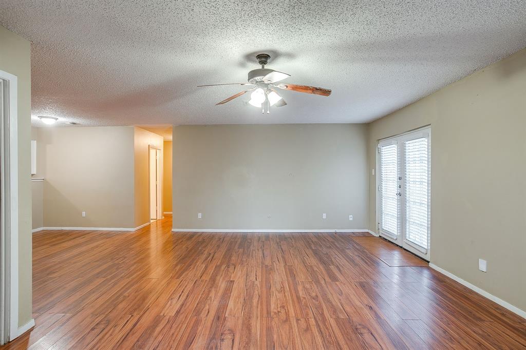 1906 Beacon Way Fort Worth, TX 76140 - Photo 7 of 36 wooden floor in an empty room with a window