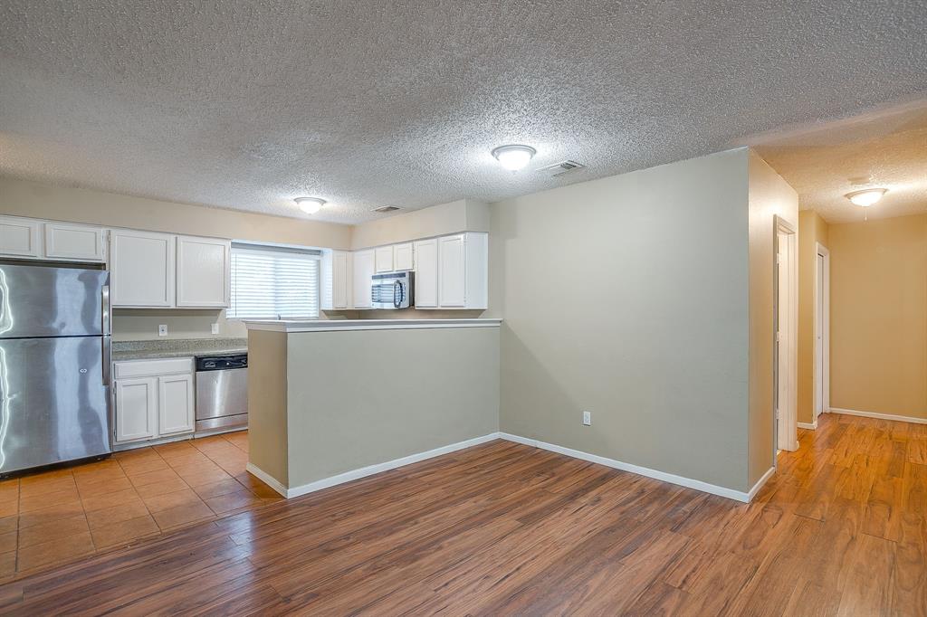 1906 Beacon Way Fort Worth, TX 76140 - Photo 9 of 36 a view of kitchen with wooden floor and electronic appliances