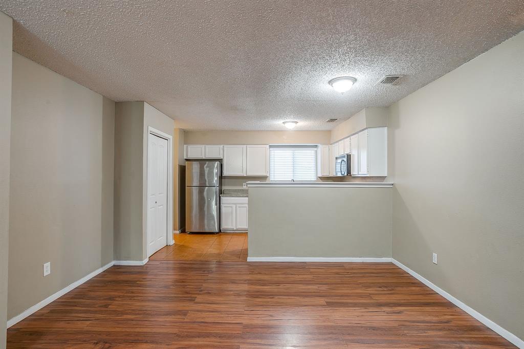 1906 Beacon Way Fort Worth, TX 76140 - Photo 10 of 36 a view of a kitchen with a sink and wooden floor