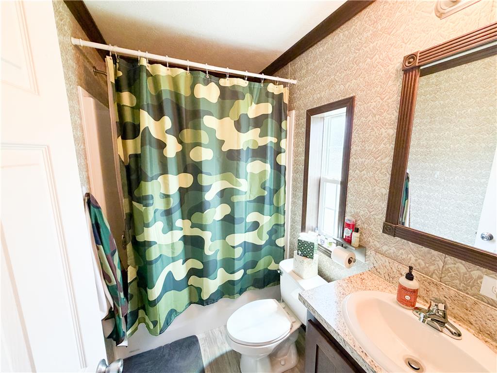 49 Ritz Craft Street Walnutport, PA 18088 - Photo 15 of 17 A well-lit bathroom features a vanity with granite counters and a practical layout.