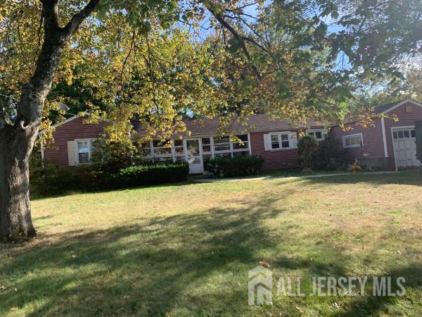 131 Morningside Road Colonia, NJ 07067 - Photo 2 of 3 a front view of a house with a yard