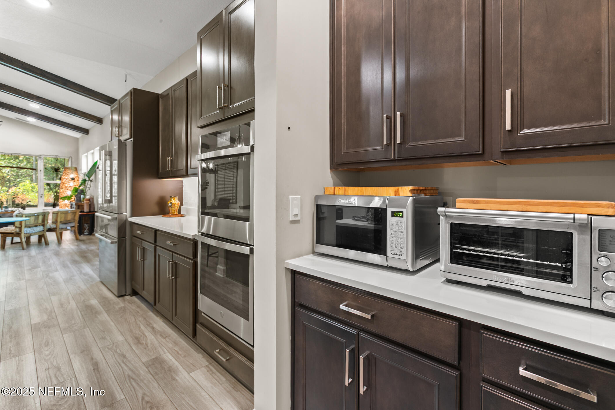 11080 Engineering Way Jacksonville, FL 32256 - Photo 15 of 74 a kitchen with stainless steel appliances granite countertop a refrigerator microwave and stove top oven