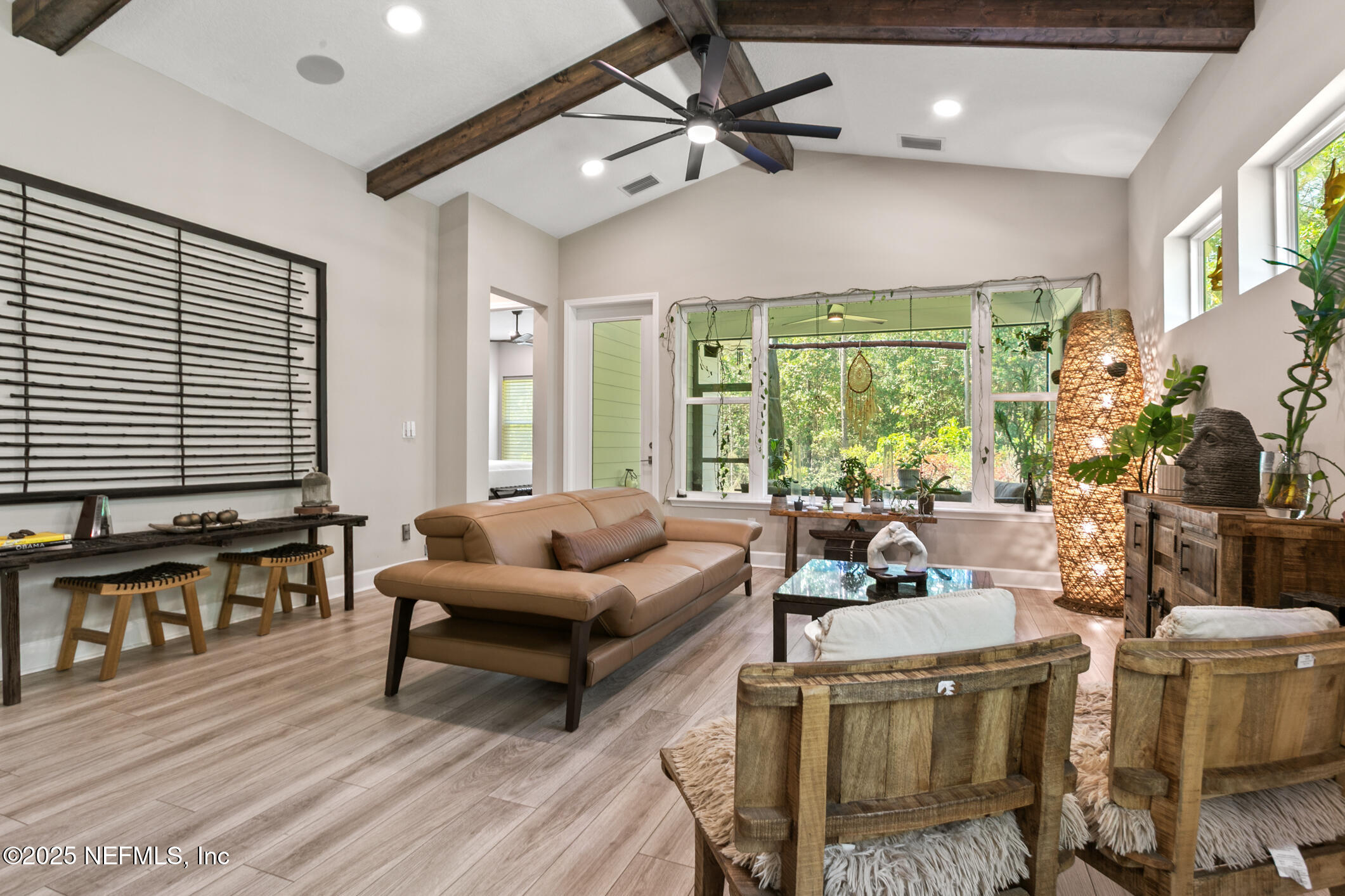 11080 Engineering Way Jacksonville, FL 32256 - Photo 19 of 74 a living room with furniture and floor to ceiling windows