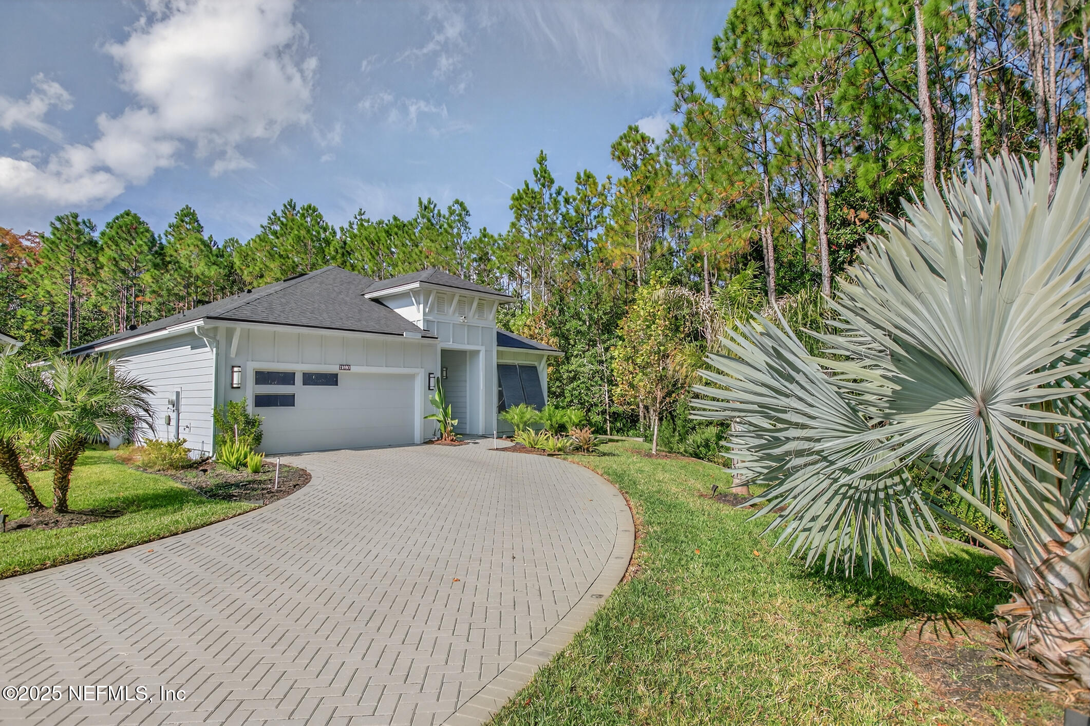 11080 Engineering Way Jacksonville, FL 32256 - Photo 2 of 74 a front view of a house with a garden and trees