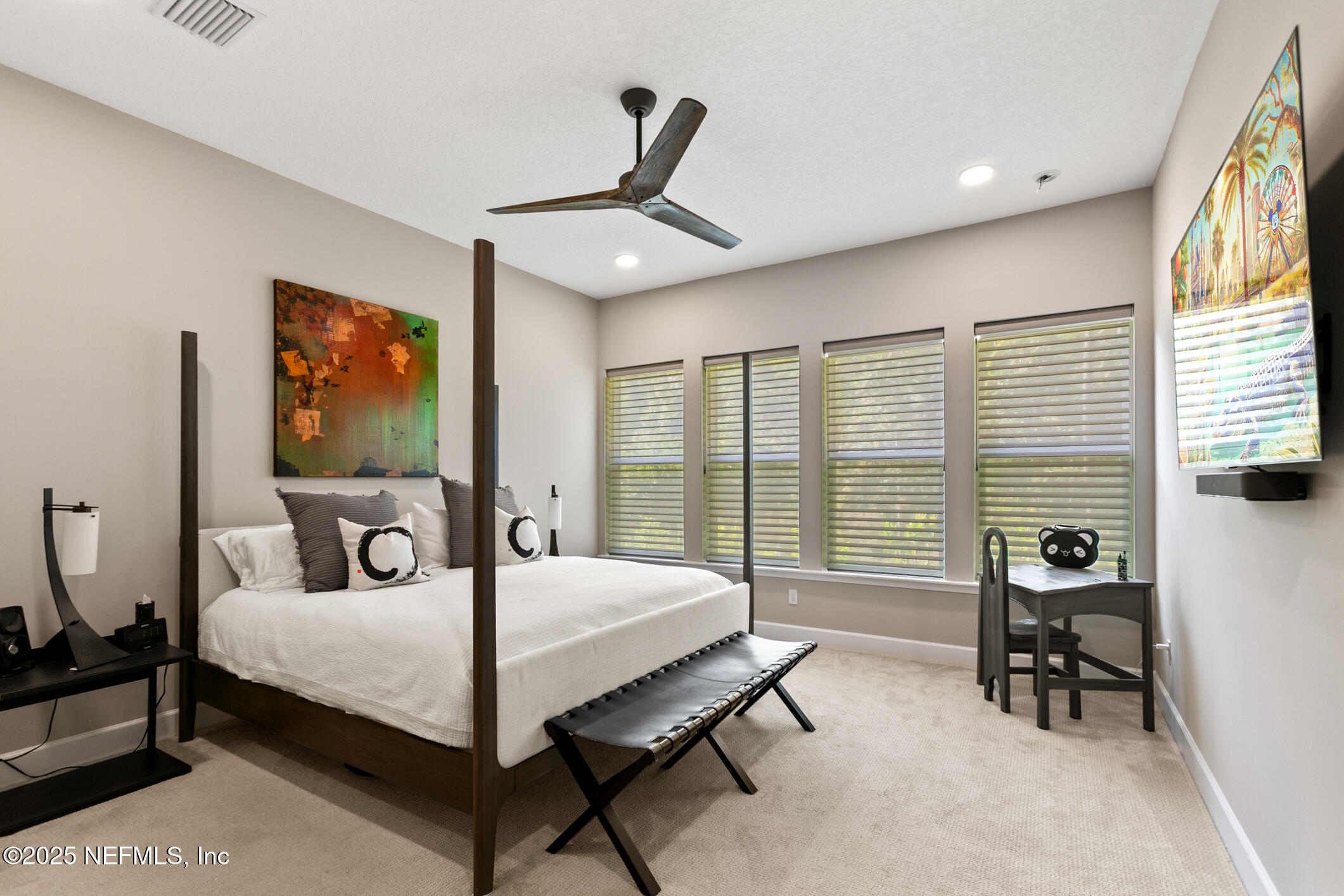 11080 Engineering Way Jacksonville, FL 32256 - Photo 23 of 74 a bedroom with a bed and large windows