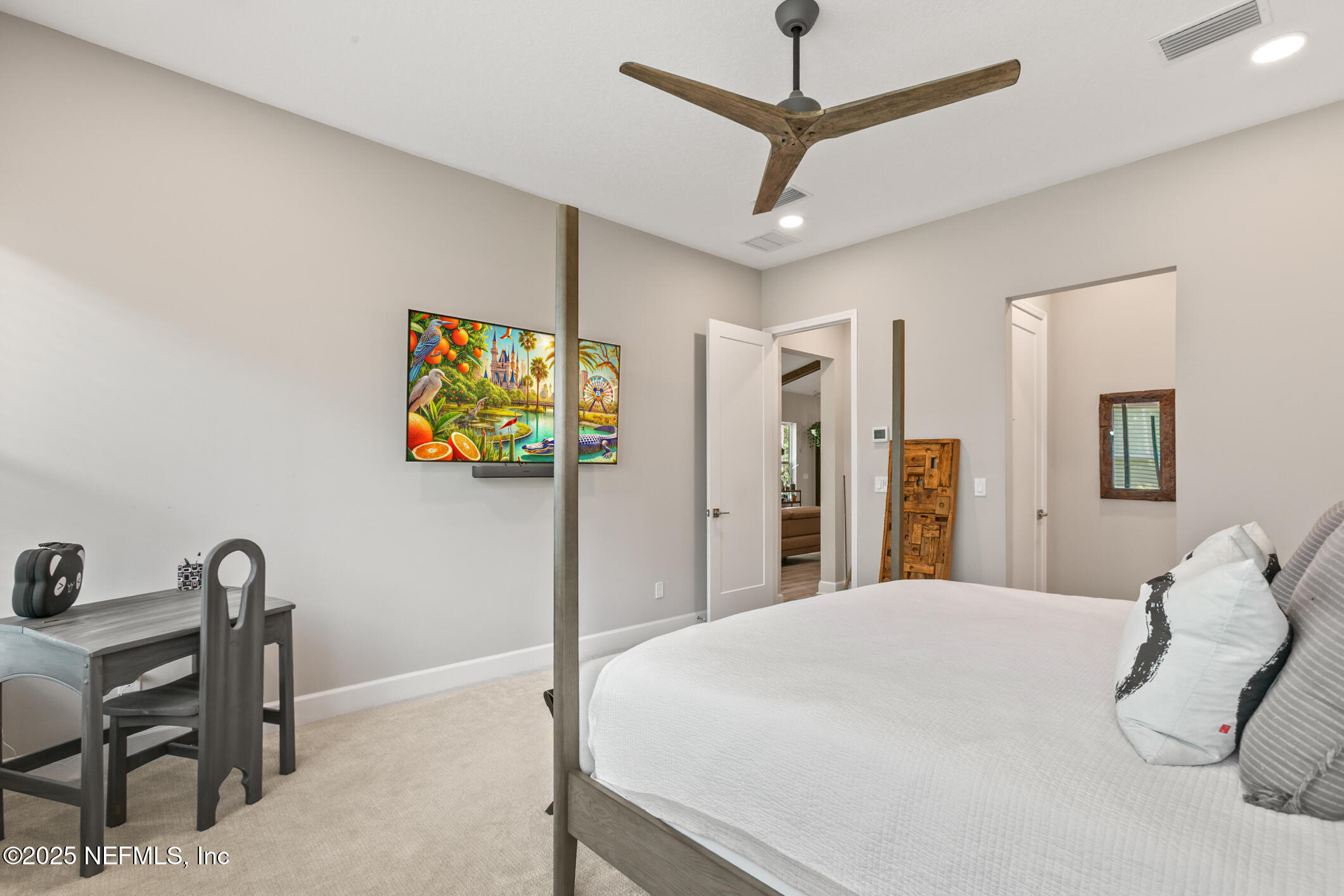 11080 Engineering Way Jacksonville, FL 32256 - Photo 25 of 74 a bedroom with a bed and a desk