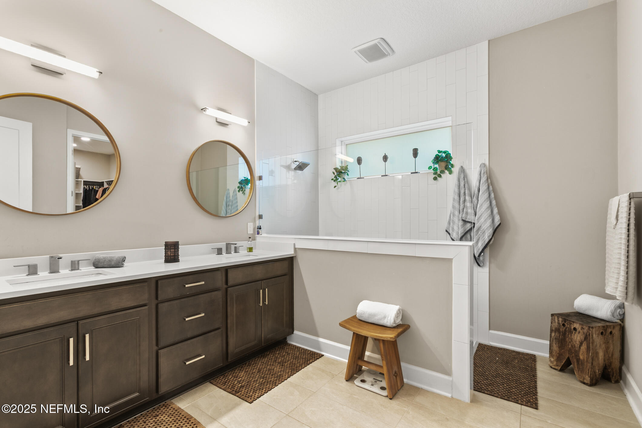 11080 Engineering Way Jacksonville, FL 32256 - Photo 28 of 74 a bathroom with a double vanity sink and a mirror