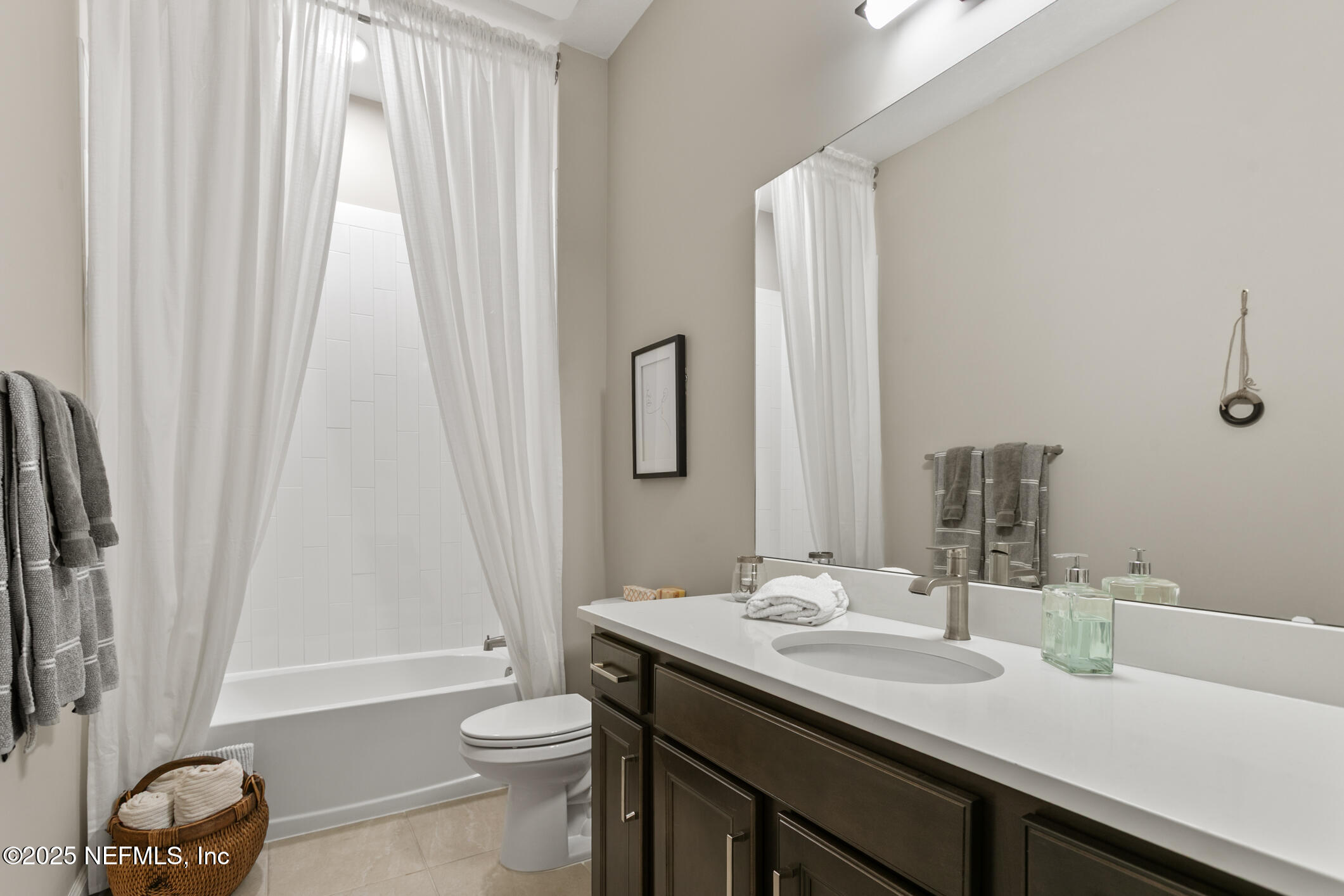 11080 Engineering Way Jacksonville, FL 32256 - Photo 32 of 74 a bathroom with a granite countertop sink toilet and a large mirror