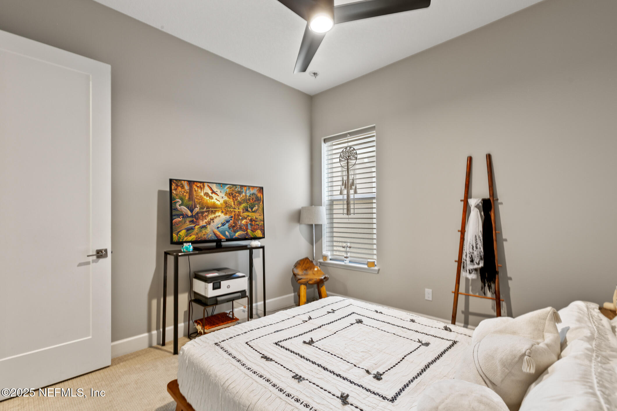 11080 Engineering Way Jacksonville, FL 32256 - Photo 39 of 74 a bedroom with a bed and a flat screen tv