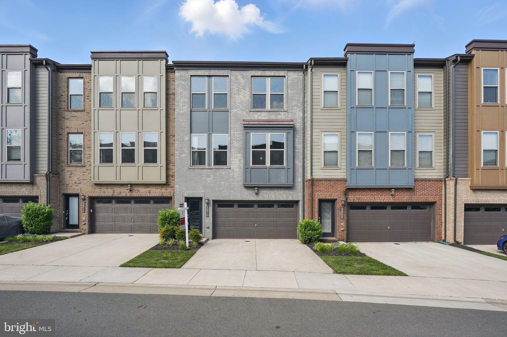 a front view of a building with a yard