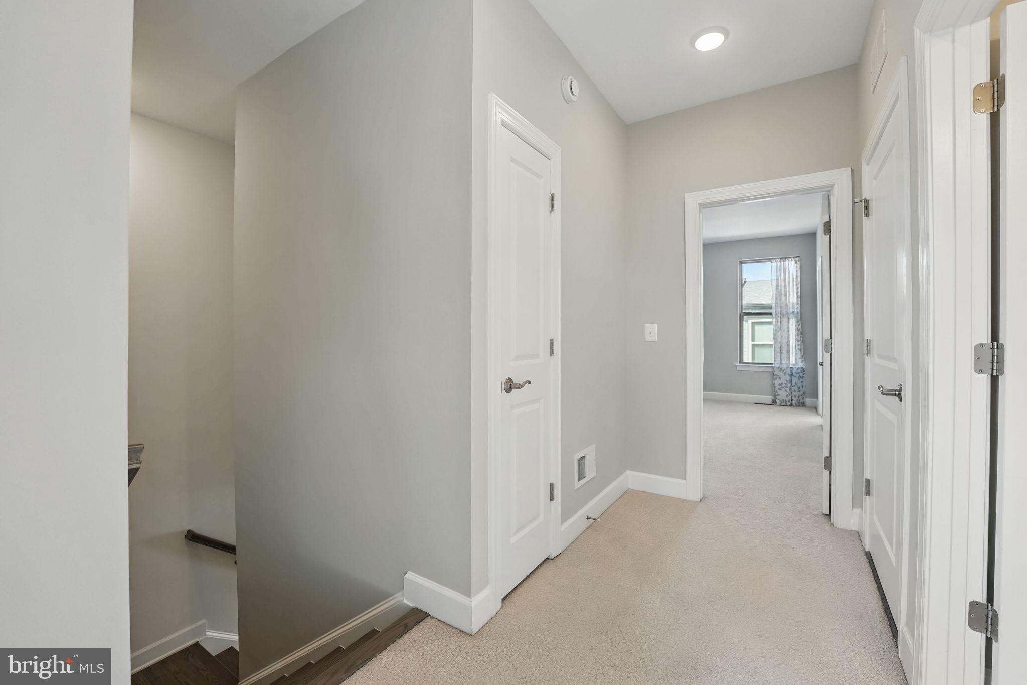 9870 Buchanan Loop Manassas, VA 20110 - Photo 16 of 41 a view of a hallway with wooden floor