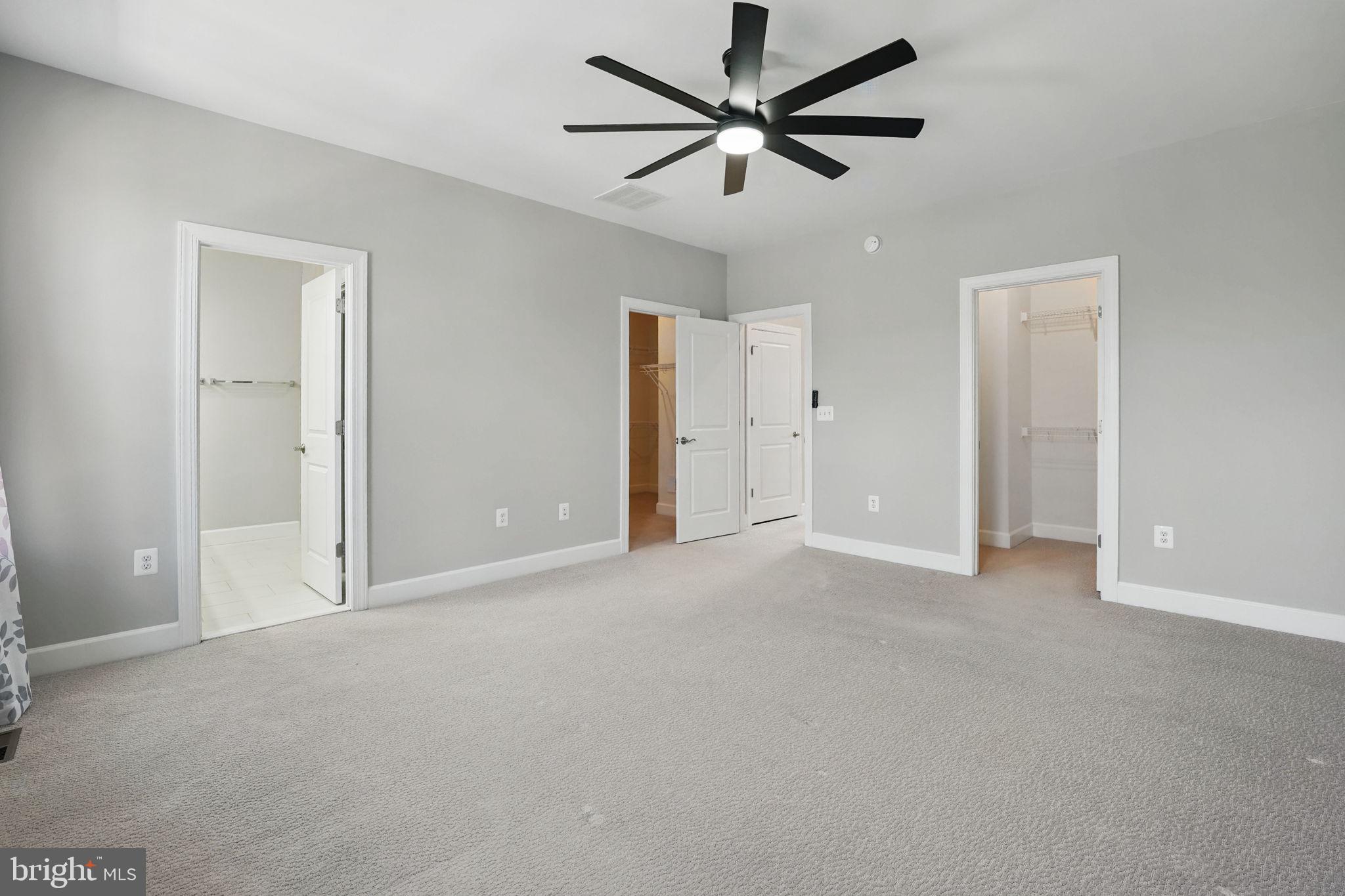9870 Buchanan Loop Manassas, VA 20110 - Photo 24 of 41 an empty room with ceiling fan and window