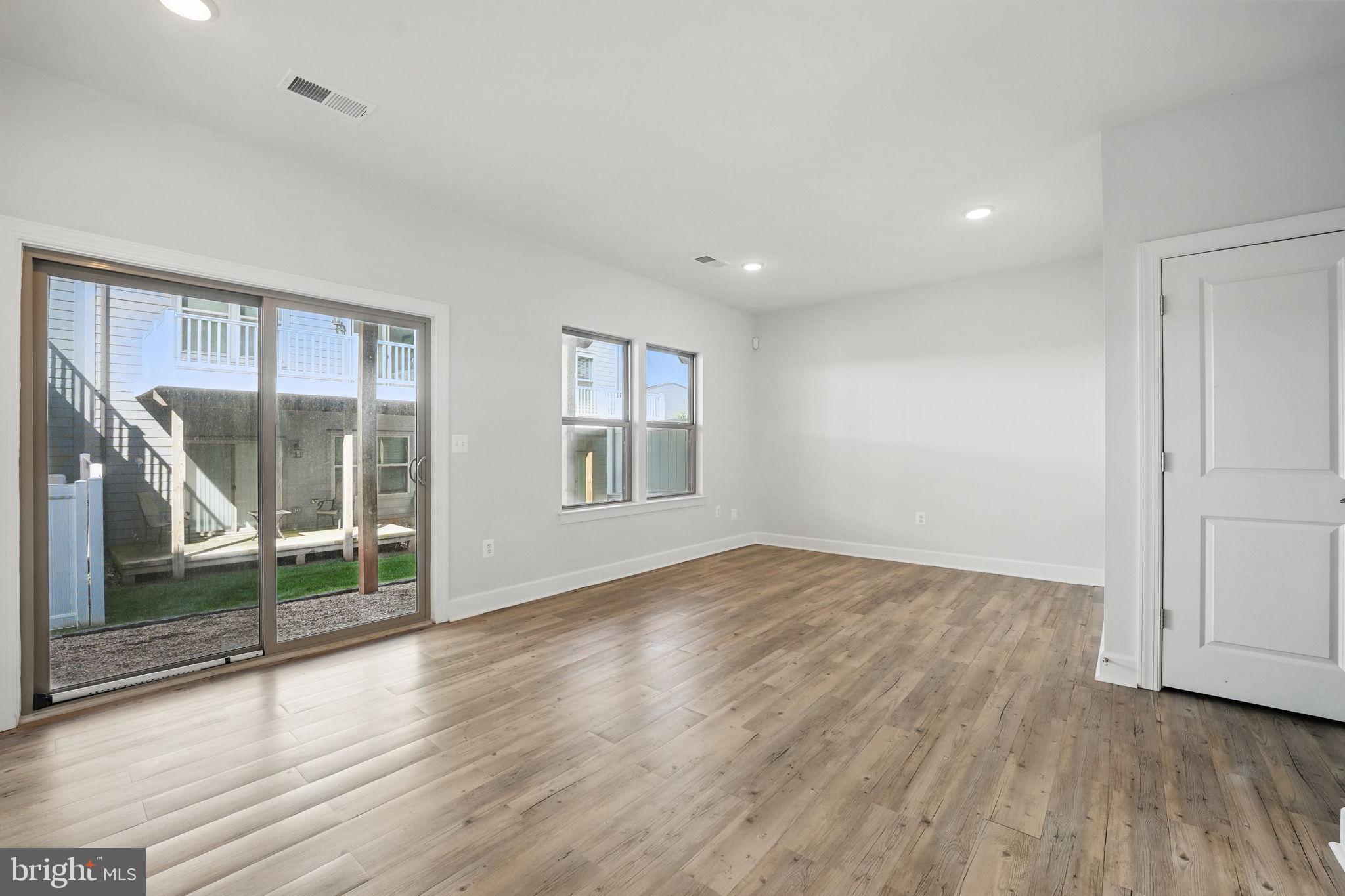 9870 Buchanan Loop Manassas, VA 20110 - Photo 29 of 41 wooden floor in an empty room with a window