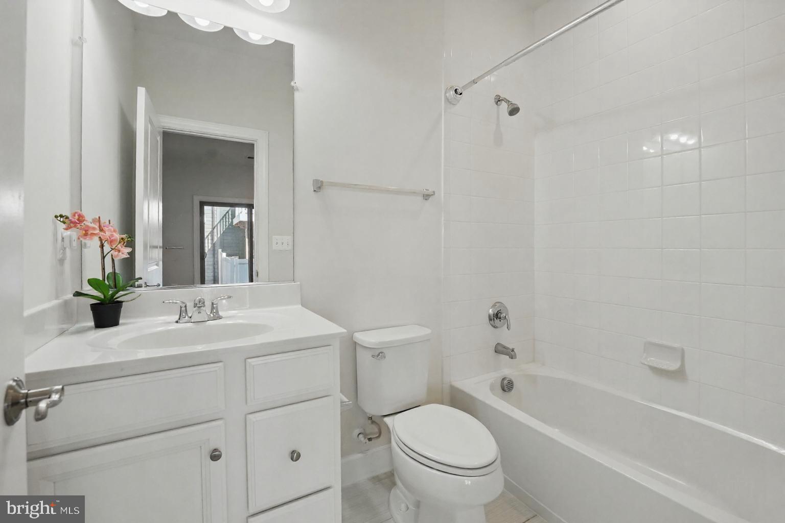 9870 Buchanan Loop Manassas, VA 20110 - Photo 31 of 41 a bathroom with a sink a toilet and shower