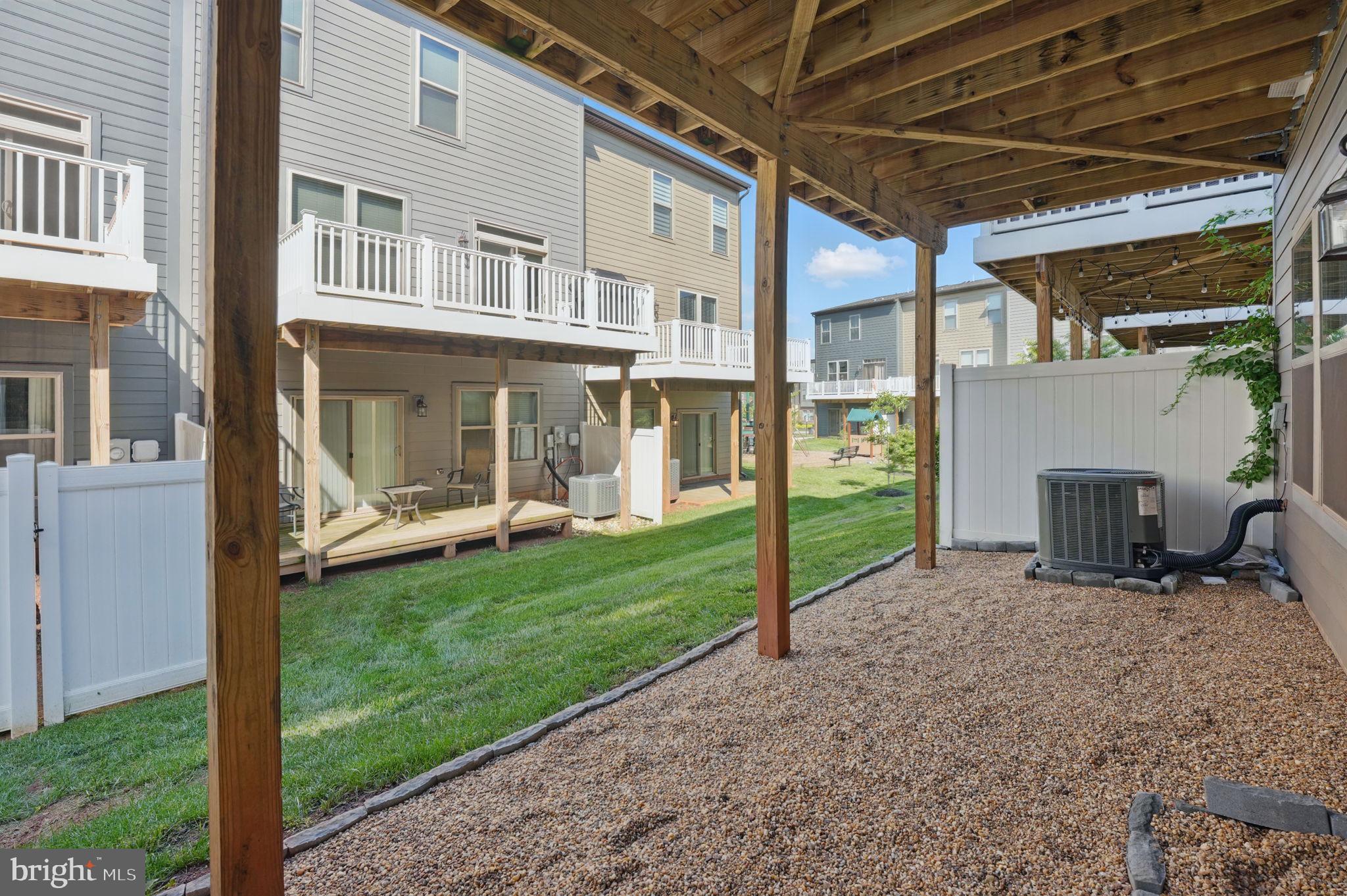 9870 Buchanan Loop Manassas, VA 20110 - Photo 32 of 41 a view of a house with backyard and porch