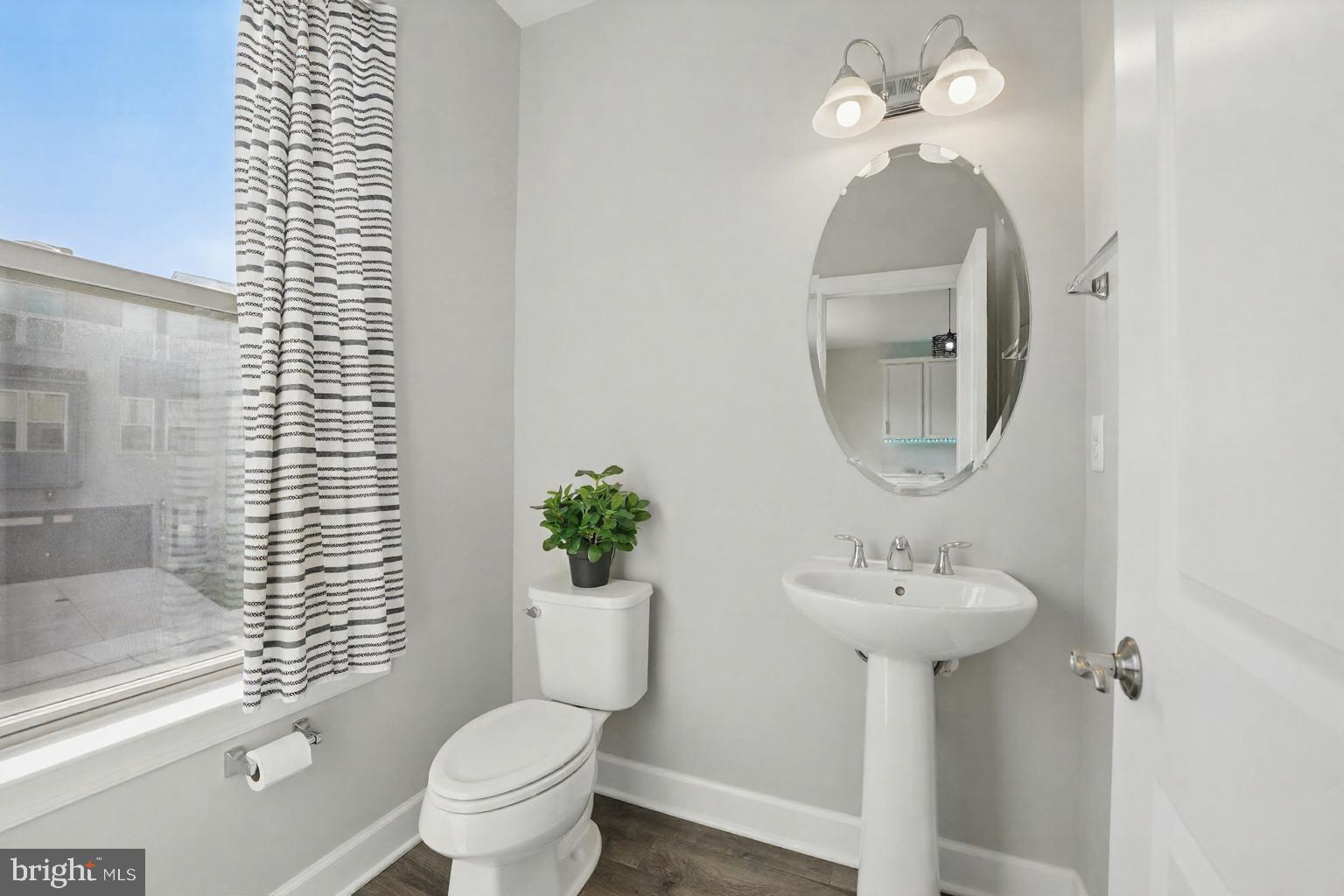 9870 Buchanan Loop Manassas, VA 20110 - Photo 5 of 41 a bathroom with a sink toilet and a mirror