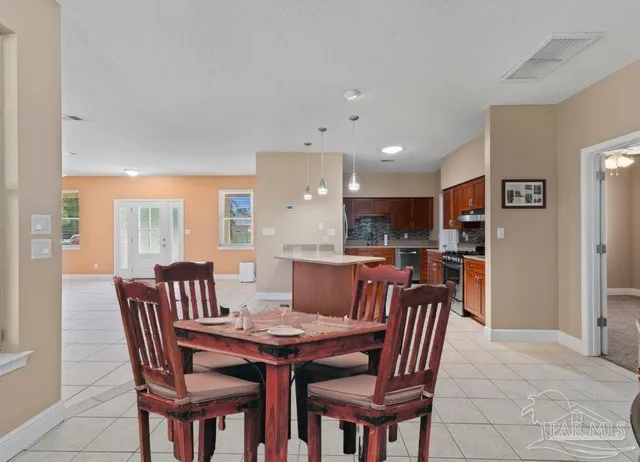 a view of a dining room with furniture