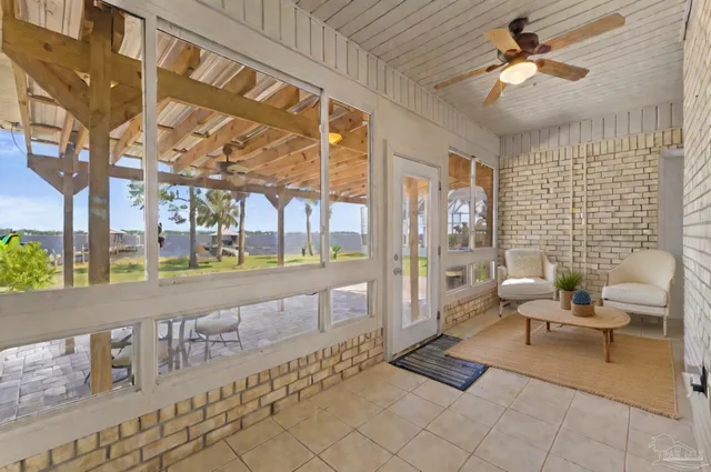 a building outdoor space with patio furniture and potted plants